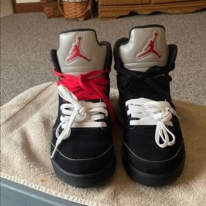 Black High-Top Sneakers with Red and White Laces